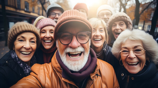 Happy senior friends taking selfie picture during winter time with city on background - Travel and elderly community lifestyle concept