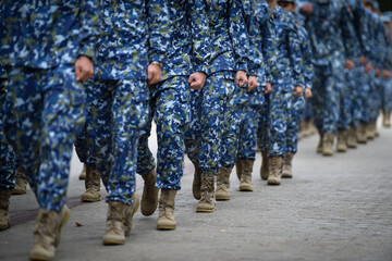 Fototapeta na wymiar Soldiers in marching formation during military recruitment