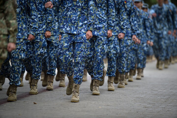Soldiers in marching formation during military recruitment