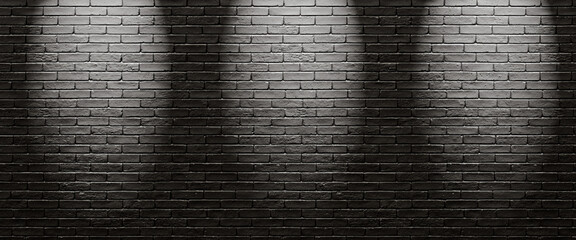 A partition wall illuminated by three light sources