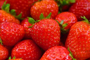 Close up view of a fresh ripe strawberries. Background. No people.