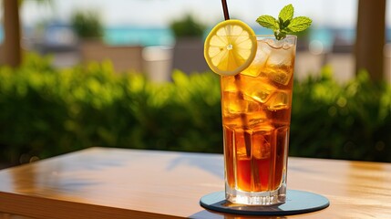  a tall glass of iced tea with a lemon slice and mint.  generative ai