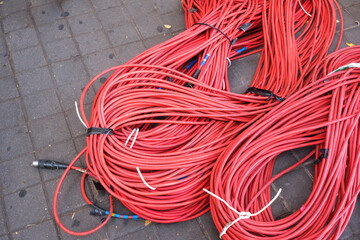 Coaxial cables for live television connections, roll on the ground.