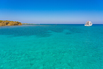 Blue lagoon with tourist boats at a moment of relaxation, Polis, Cyprus. September 2023