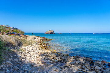 Aphrodite's paradisiacal beach with sand and stones and turquoise blue water, Paphos, Cyprus. September 2023