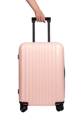 Hand holding handle of wheeled suitcase, spinner luggage, pink bag isolated on white