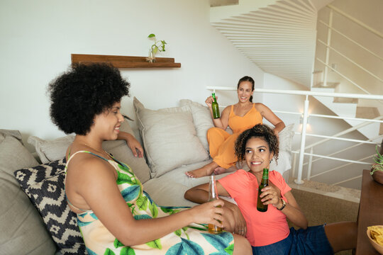 Group Of Female Friends Having A Small Gathering At Home