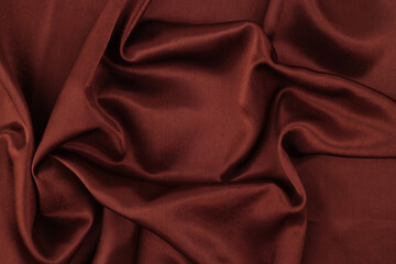 Brown pearl wave silk fabric. Abstract texture copy space background.