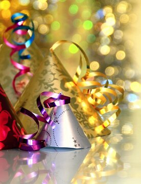 New Years celebration with colorful party hats with twinkle light background no people stock image stock photo