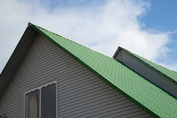 Metal tile.Roof for the house. Modern coatings for the roof of the house.