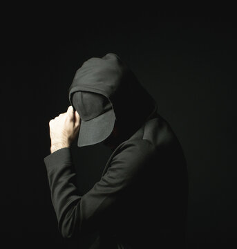 Black Hat Hoodie Sweater Man Hacker Alone in Dark