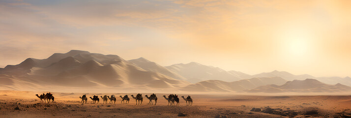 A Long Camel Train Moves through the Sun Scorched Desert of Saudi Arabia - obrazy, fototapety, plakaty