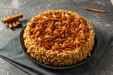 churros cake with dulce de leche on top. sweet cake dessert
