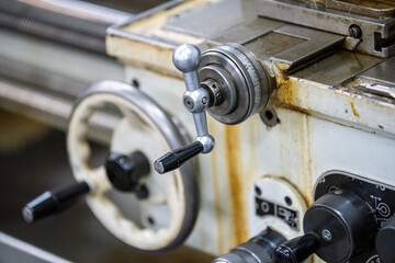 Old lathe machine on the background close-up image