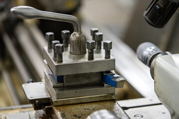 Old lathe machine on the background close-up image