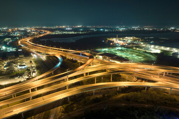 Fototapeta na wymiar Aerial view of american highway junction at night with fast driving vehicles in Tampa, Florida. View from above of USA transportation infrastructure
