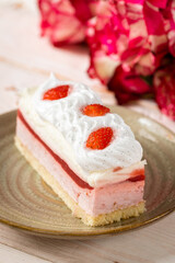 Delicious sweet cake close-up selective focus, cake with white protein cream decorated with strawberries