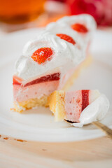 Delicious sweet cake close-up selective focus, cake with white protein cream decorated with strawberries