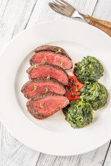 Flank steak with creamy spinach