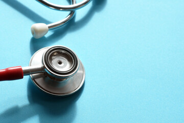 Stethoscope on blue background. Heart health, health insurance concept, world heart day, world...