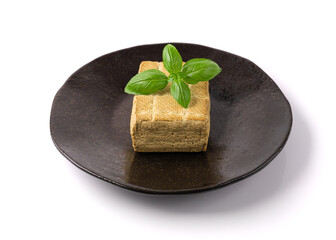 Tofu Cheese Isolated, Smoked Vegan Cheese Slice, Sliced Soya Bean Curd, Soy Protein or TSP