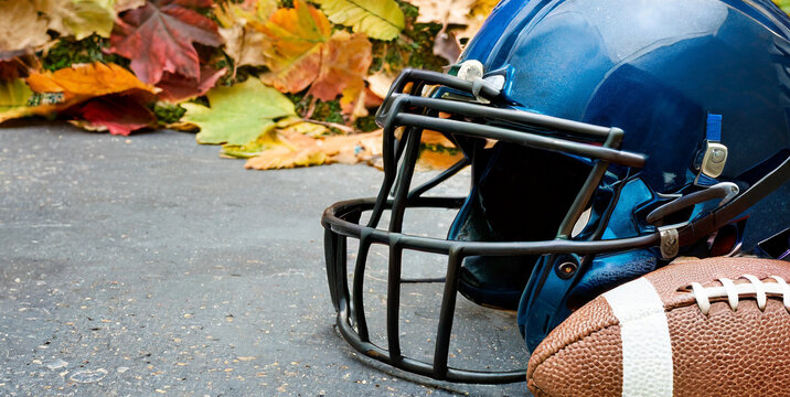 Thanksgiving American Football Game Concept With Copy Space A Generic Helmet And Ball On The