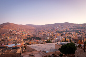 Obraz premium Panoramic view cityscape of Wadi Musa, Jordan at sunrise