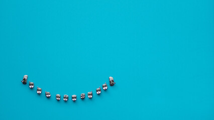 Close up orthodontic model and dentist tool - demonstration teeth model of multi color of orthodontic bracket or brace. colorful braces.