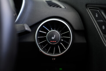 Heated seats button in sports car
