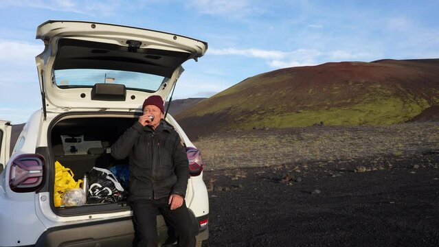 Hiker Sipping Coffee In His Parked Car At Raudhaskal