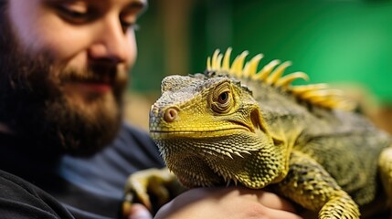 A reptile enthusiast interacts with their exotic pet, demonstrating the fascination and affection that can exist in the unique bond between humans and reptiles.