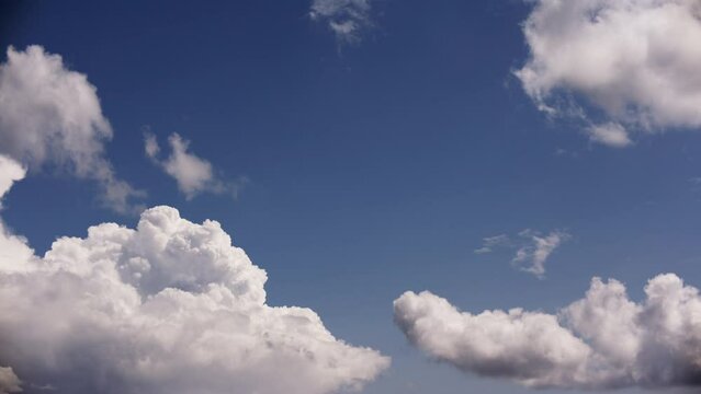 White Cumulus Clouds Adorning The Blue Sky