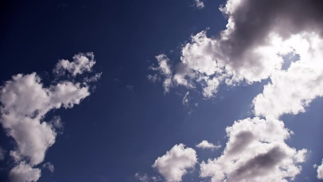 Watching White Clouds Drift In The Blue Sky