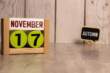 Wood blocks in box with date, day and month 17 November. Wooden blocks calendar