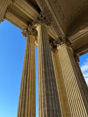 Fototapeta premium antique columns of the cathedral against the blue sky - architecture stock photo