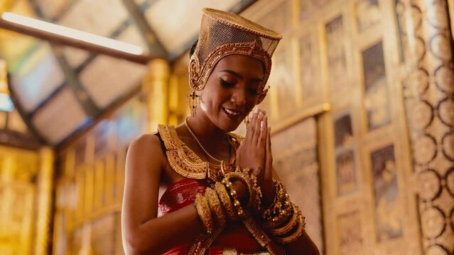 A Lady Wearing Chut Thai Praying Happily