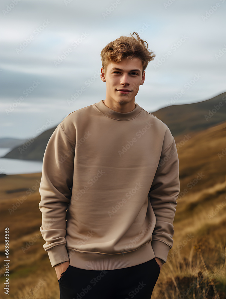 Poster sweatshirt mockup one young man guy boy in a tan blank crewneck outside in the autumn fall hills ove