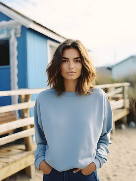 Photo portrait of a woman girl at the beach blue sweatshirt mockup