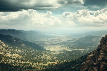 Obraz premium A picturesque landscape with mountains and valleys under a cloudy sky