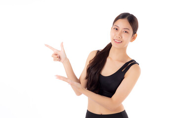 Obraz na płótnie Canvas Portrait of beautiful young asian woman in sportswear smile and presenting isolated on white background, sport and exercise for health and weightloss, female and slimming showing something.
