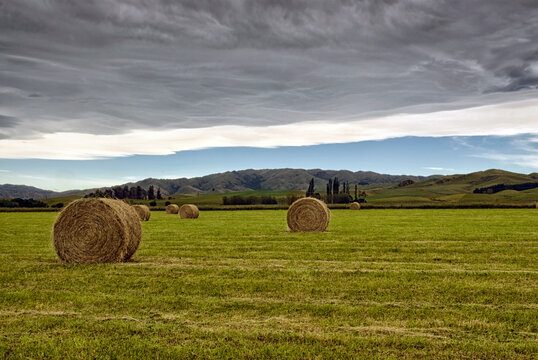 Northwest Arch forms over farmland on the Canterbury plains, Christchurch, South Island, New Zealand
