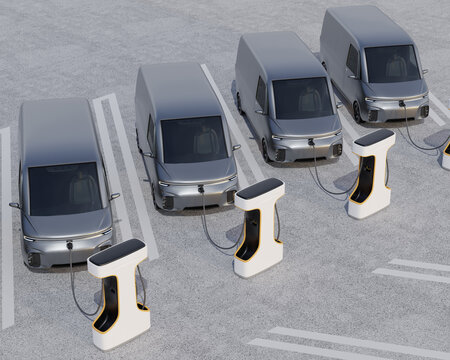 Fleet of Electric Delivery Vans charging in charging station. Generic design. 3D rendering image.