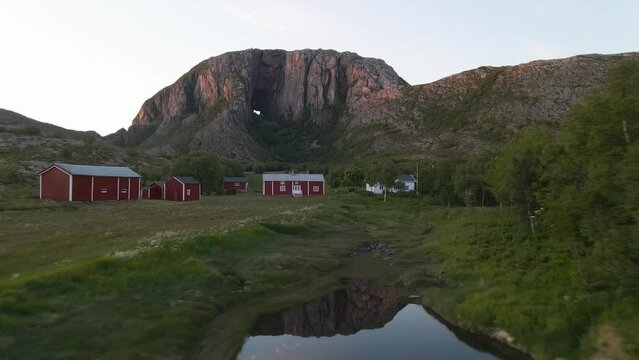 Torghatten is a mountain on Torget island in Nordland county, Norway. It is known for its characteristic hole, or natural tunnel, through its center.