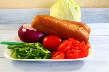 fresh vegetables slice tomatoes,slice green peppers,onion,lettuce,sub sandwich bread for prepare sandwiches for breakfast