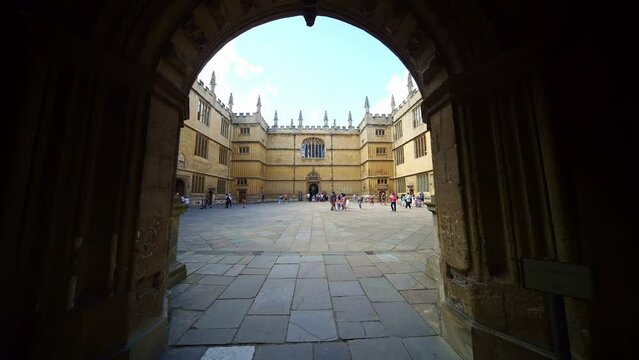 University of Oxford. Bodleian Old Library, courtyard. Historic research and one of the oldest libraries in Europe. Visitors and students on campus, England. Landmark in UK. 