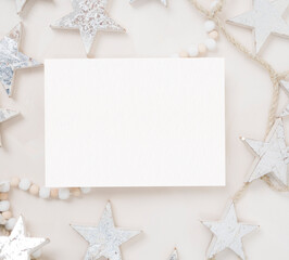 Fototapeta na wymiar Blank holiday Christmas stationery card flat lay with stars