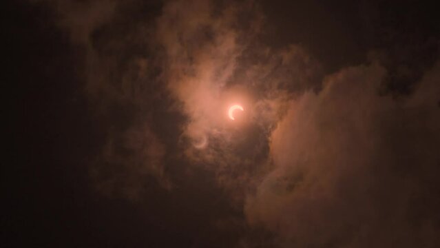 solar eclipse 2023 , cinematic 24 fps with variable ND filter. Moon crossing the sun eclipse.