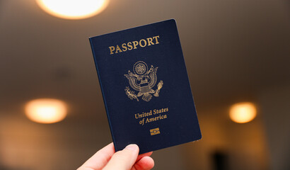 U.S. passport on a dark background, symbolizing travel, identity, citizenship, and international...