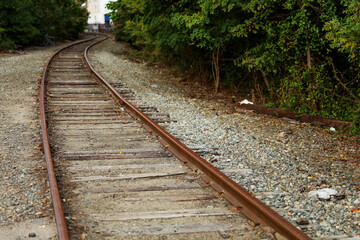 Train tracks symbolize progress and direction, as they lead into the unknown, a metaphor for hope's...