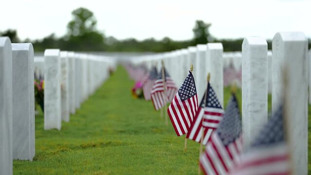 Memorial Day concept. Sarasota National Cemetery with rows of white tomb stones on green grass